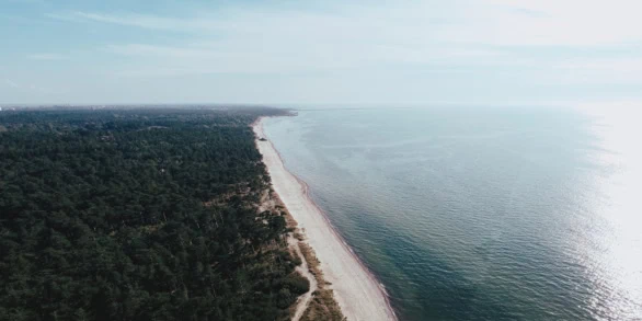 Aerial view of the pristine Karosta Beach stretching along the B