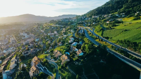 Aerial view of a scenic highway winding through vineyards and re