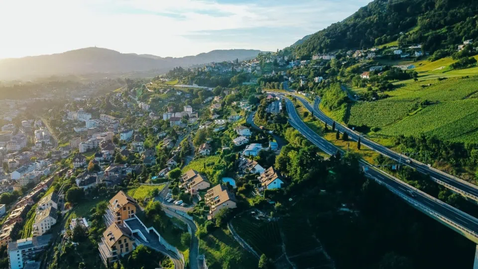 Aerial view of a scenic highway winding through vineyards and re