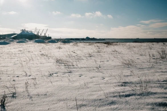 Snowy Field Under a Winter Sky in Liepāja