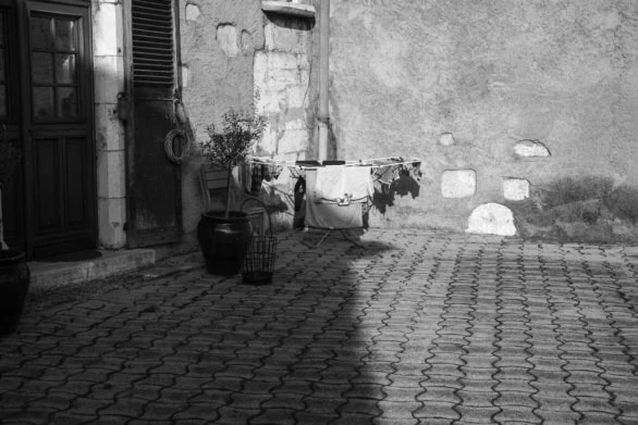 Rustic Courtyard with Laundry Drying in Sunlight