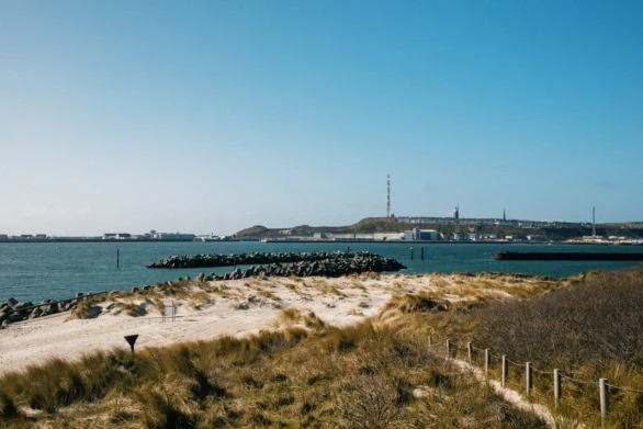 View of Helgoland Harbor and Sand Dunes on a Clear Day