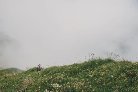 Resting Above the Clouds: A Moment on the Alpine Slopes