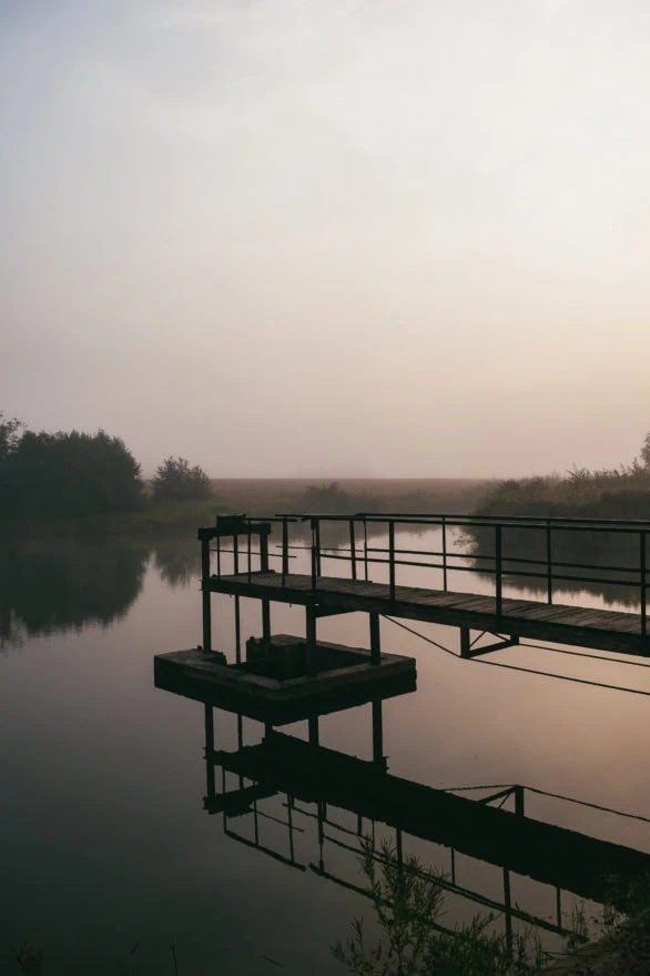 Old Platform over Misty Lake at Sunrise, Barta River, Latvia