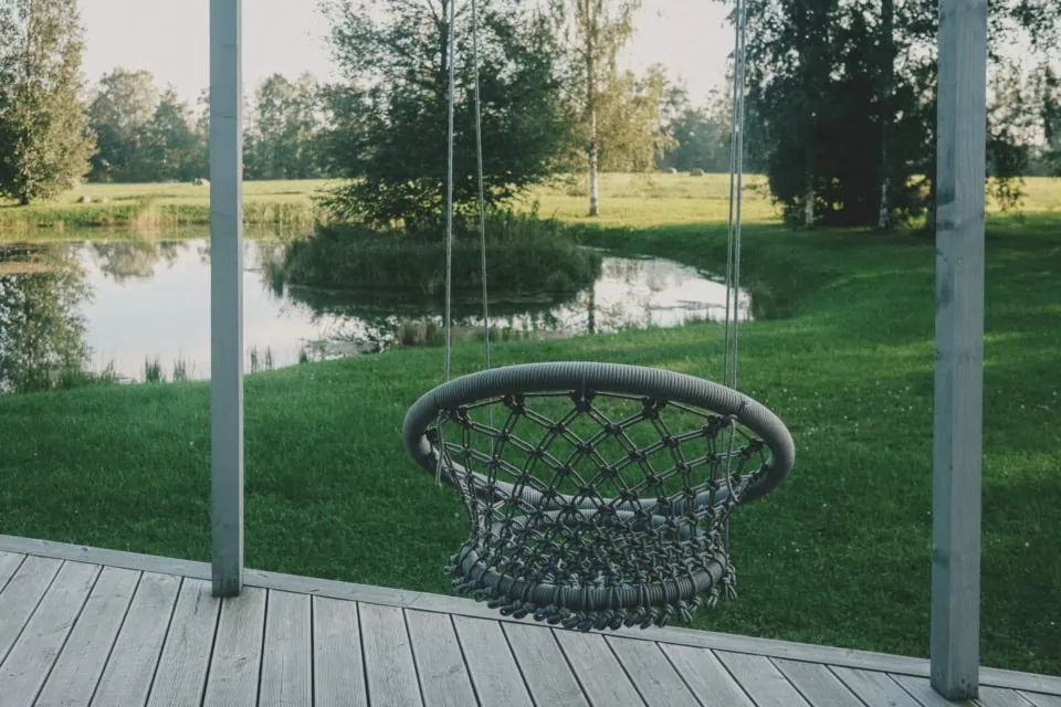 Countryside Swing Chair by a Pond