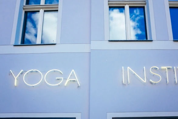 Yoga Studio Neon Sign on Lavender Wall