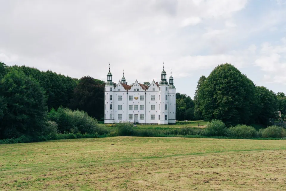 Historic castle in Ahrensburg surrounded by greenery