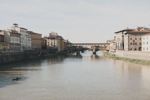 Ponte Vecchio and historic buildings reflected in the Arno River